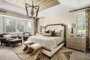 Bedroom with brown tones tied together through the bedding and pillows