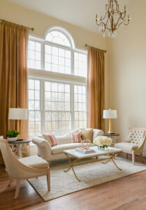 Living room with tall windows and drapes