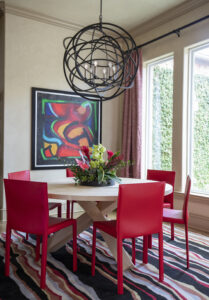 dining room with abstract artwork on the wall